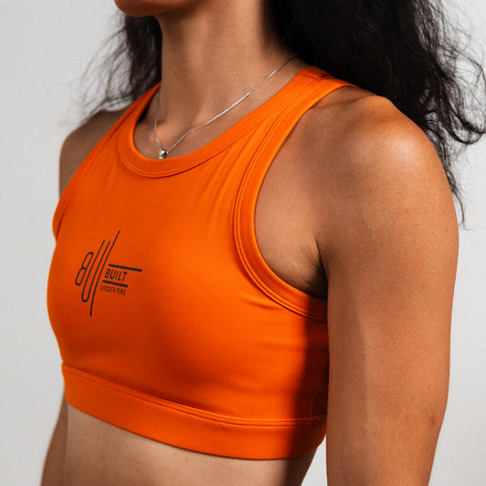 Orange Earth tank bra with supportive fit and smooth performance fabric.