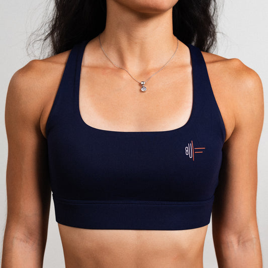 Navy multi-strap bra with supportive back design and soft stretch fabric.
