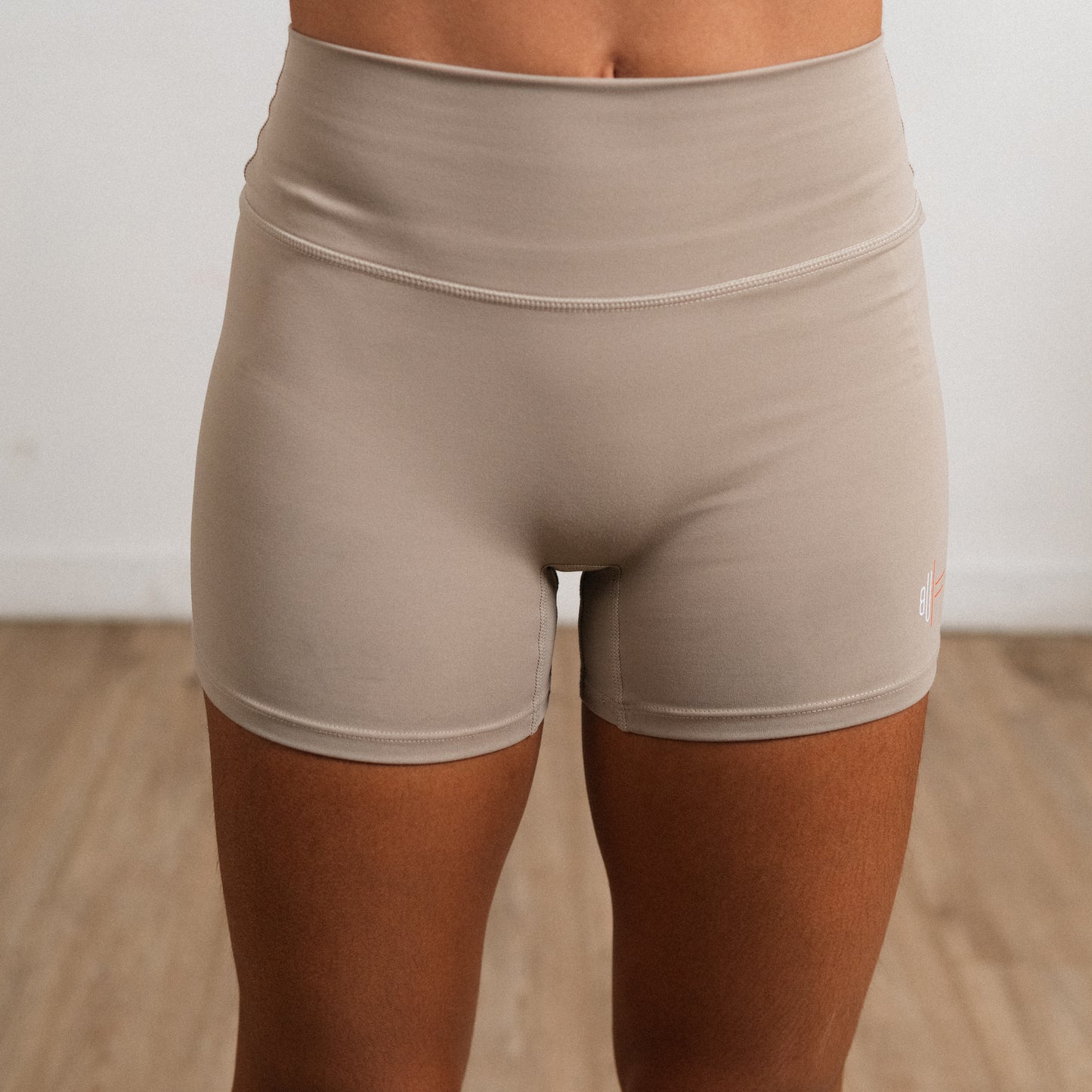 Khaki NOA shorts made with breathable stretch fabric for training and lifestyle wear.